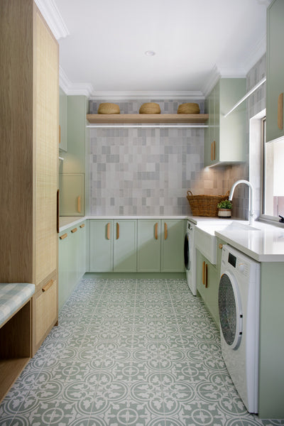 Dreamy sage laundry with custom storage galore and stunning tiles